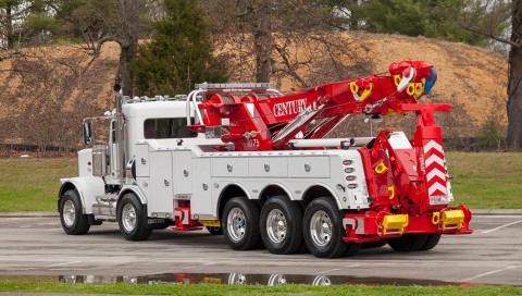 white and red century 1075 rotator on a peterbilt 389 chassis
