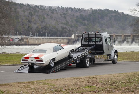 chevy camaro being loaded on 12 series lcg carrier