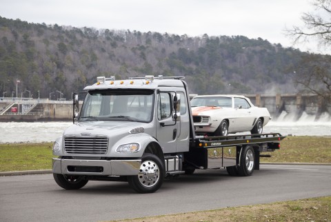 12 series lcg carrier on a freightliner m2 with chevy camaro