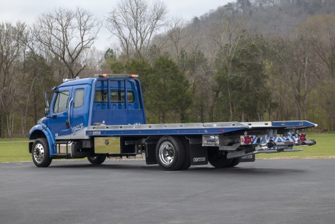 12 series lcg right approach on a blue freightliner m2 chassis