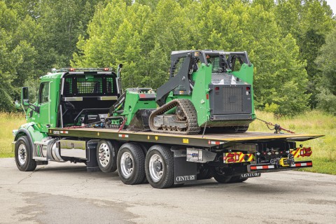 This image shows an R30 industrial carrier carrying track-style vehicles.