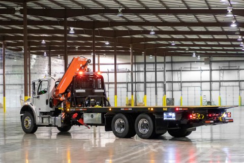 The image shows a Century R30 industrial carrier with the boom and the deck stowed in the travel position.