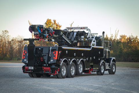 Century M65 on a black Peterbilt 589 Simard twin-steer chassis rear folded