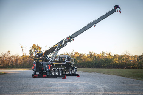 Century M65 on a black Peterbilt 589 Simard twin-steer chassis rear stretched