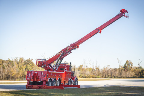 Century M65 on a red Kenworth W900 twin-steer chassis rear stretched