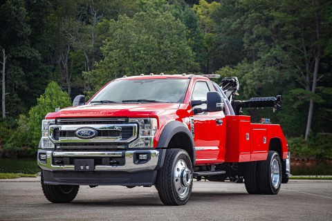 red ford f600 with a century 2465 wrecker body