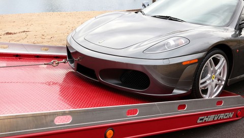 loading a ferrari on a red chevron loadrite 12 series lcg carrier