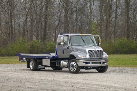 front of gray 12 series lcg carrier on an international mv chassis