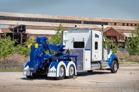 holmes dtu unit on kenworth w990 chassis in front of old factory