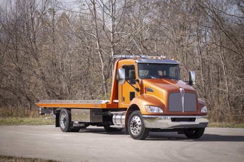 orange 12 series lcg carrier on a kenworth chassis