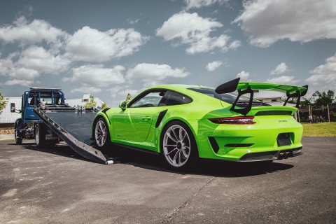 Green Porsche 911 GT3RS loading on a Vulcan 12 series LCG carrier with extreme angle option