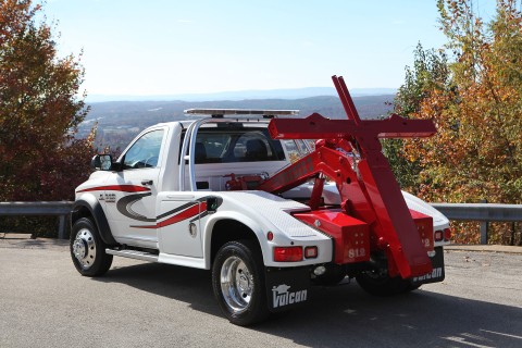 white and red vulcan 812 intruder 2 wrecker on a ram trucks chassis at an overlook