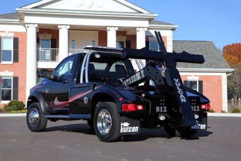 black 812 intruder 2 on a ram trucks chassis in front of a house