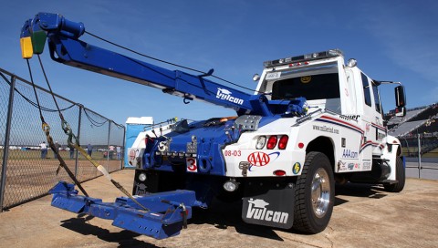white and blue vulcan 892 at a nascar racetrack