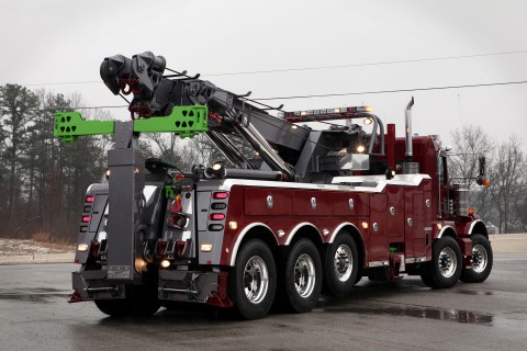 red and gray vulcan 975 rotator in a wet parking lot