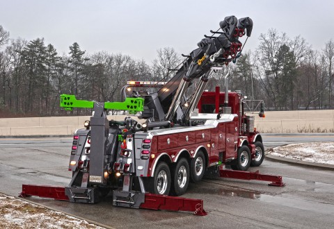 vulcan 975 rotator with boom rotated and outriggers extended in a parking lot